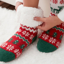 Load image into Gallery viewer, The Foozie™ Christmas Winterland slipper socks, close-up of a hand holding the thick sherpa cuff open