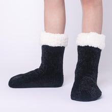 Load image into Gallery viewer, The Foozie™ in Black, front view of both feet worn in Kids/Small with the sherpa cuffs folded down