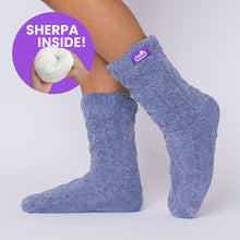 Load image into Gallery viewer, The Foozie™ Move in Blue, side view on foot with a 'Sherpa inside' badge showing the lining
