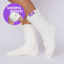 Load image into Gallery viewer, The Foozie™ Move in White, side view on foot with a 'Sherpa inside' badge showing the lining
