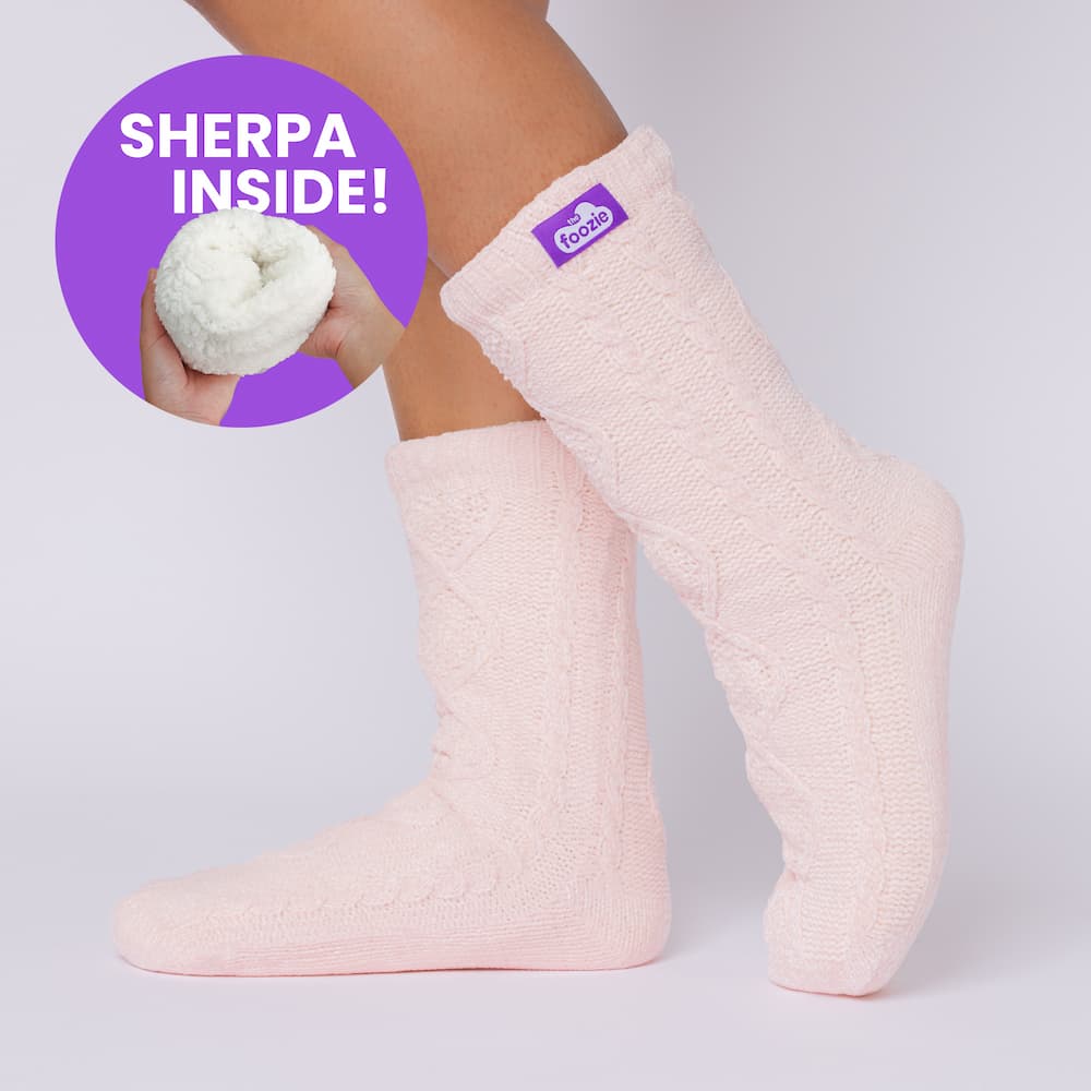 The Foozie™ Move in Pink, side view on foot with a 'Sherpa inside' badge showing the lining