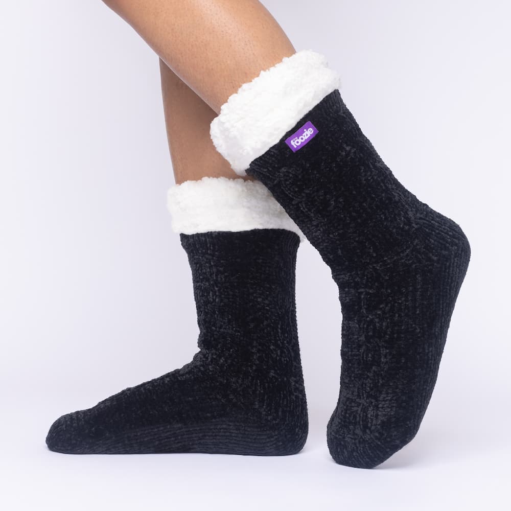 The Foozie™ in Black, side view worn in Medium with the sherpa cuff folded down