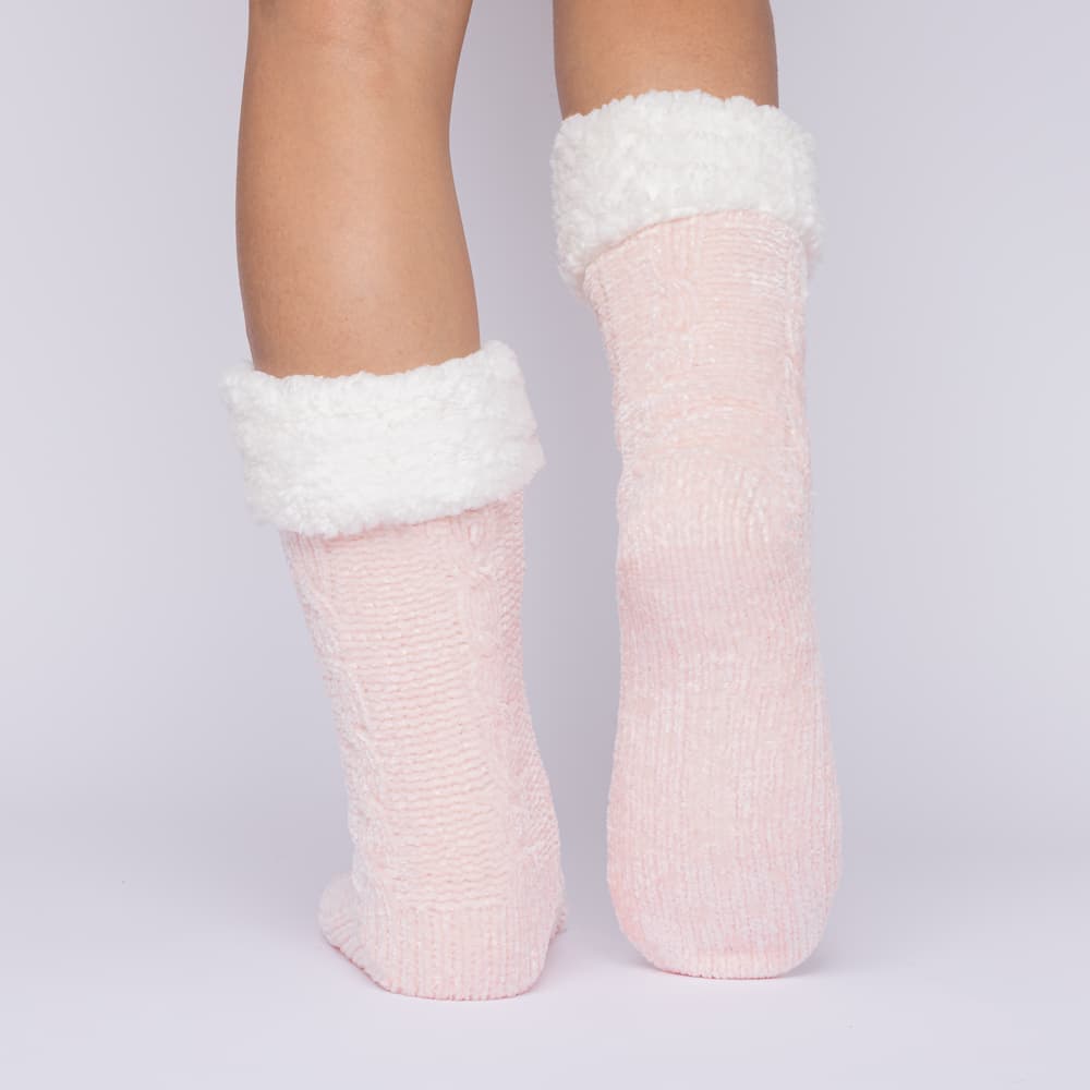The Foozie™ in Pink, back view with one foot raised to show the sole