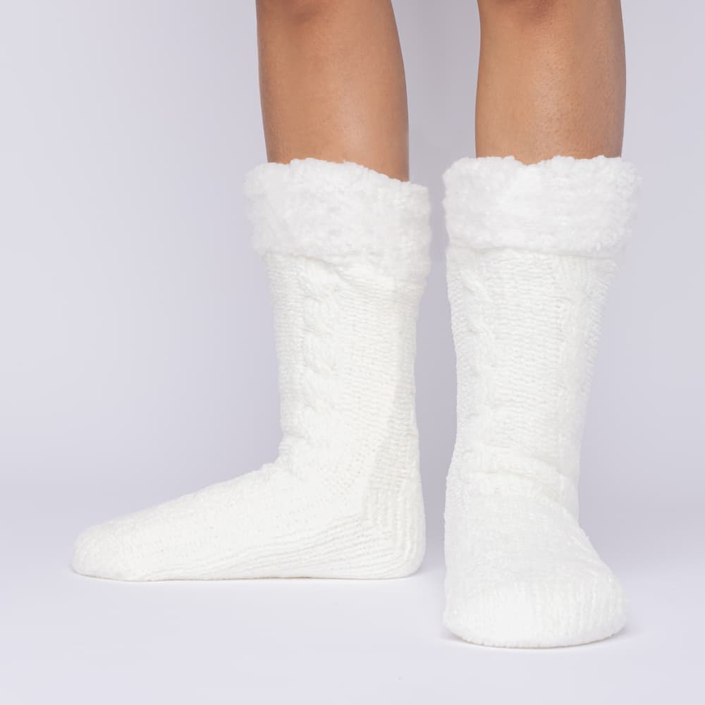 The Foozie™ in White, front view of both feet worn in Medium with the sherpa cuffs folded down