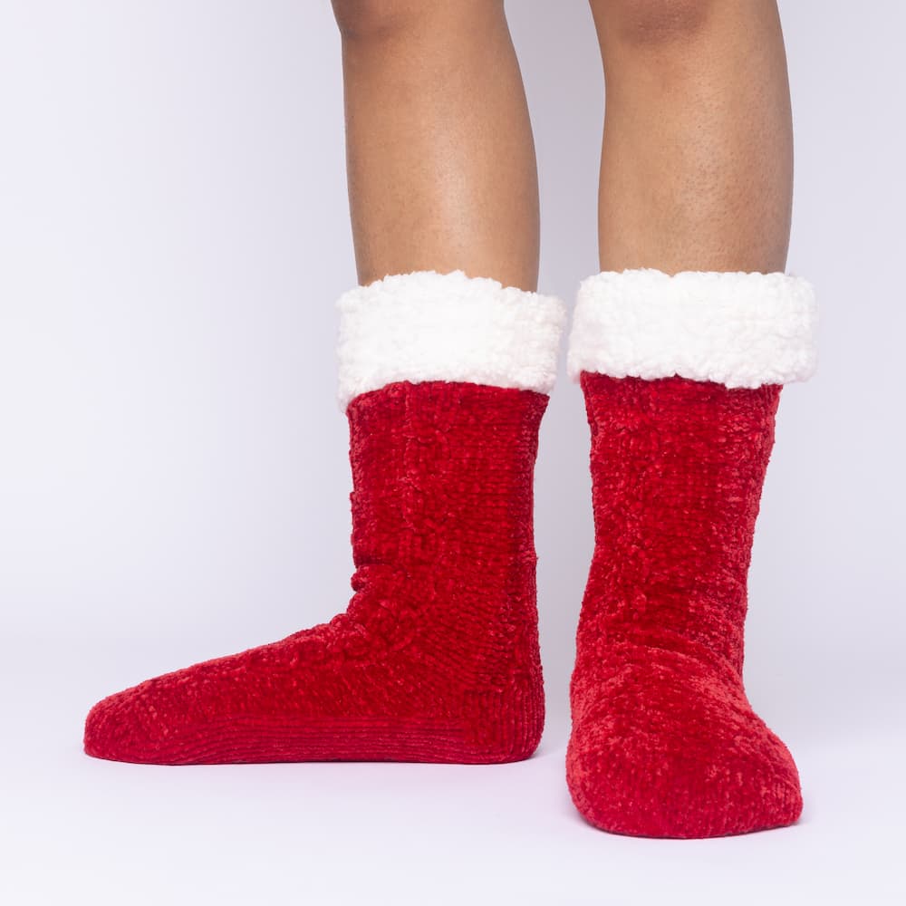 The Foozie™ in Red, front view of both feet worn in Medium with the sherpa cuffs folded down