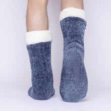 Load image into Gallery viewer, The Foozie™ in Blue, back view worn by a man in Large with one foot raised to show the non-slip grips on the sole
