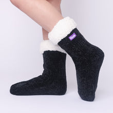 Load image into Gallery viewer, The Foozie™ in Black, side view worn in Kids/Small with the sherpa cuff folded down

